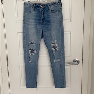 Light wash ripped American Eagle skinny jeans.
